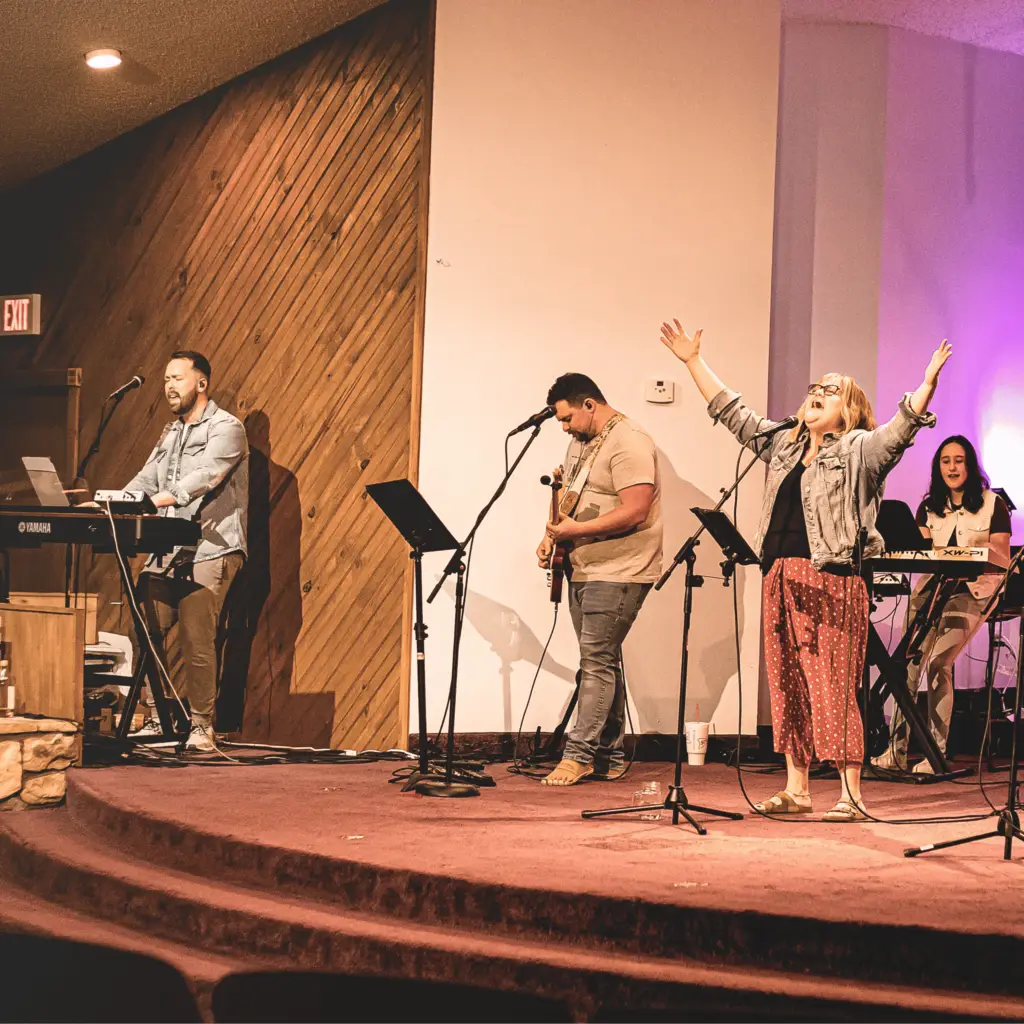 Worship leader praising God at Open Door Church in Shawnee